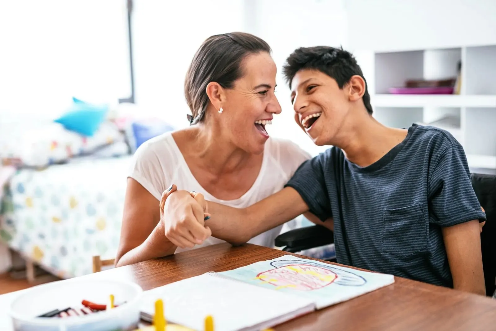 Caregiver sharing a moment with a young adult