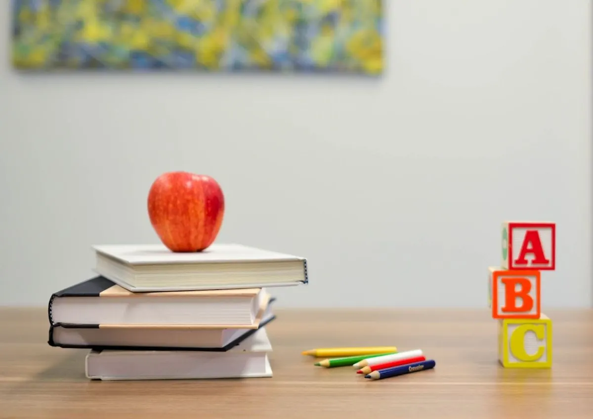 Preschool table with blocks, books and colored pencils