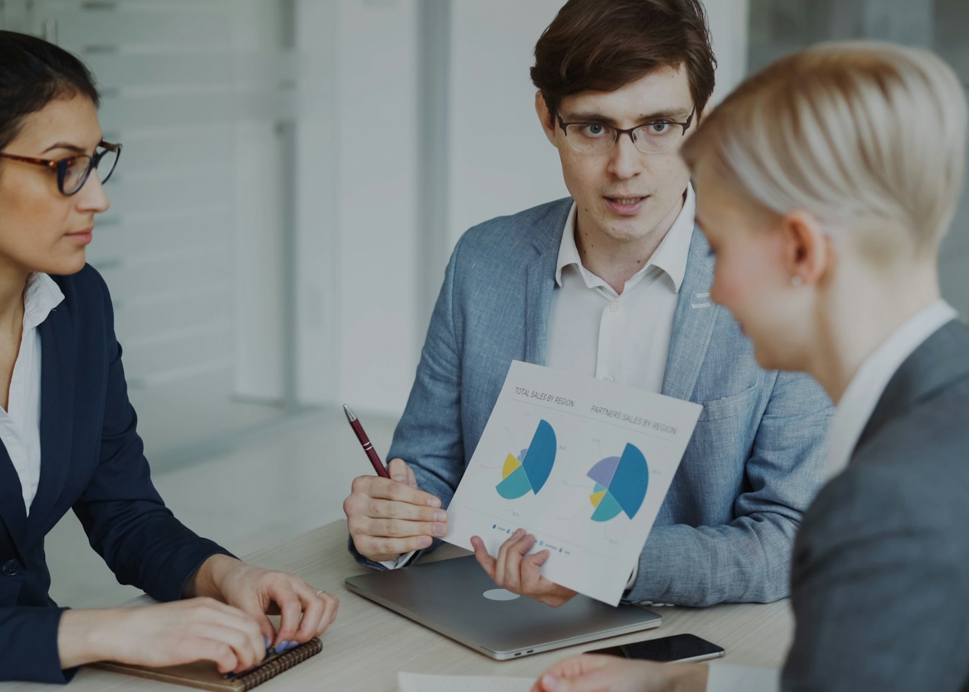 Accounting advisor presenting financial charts to business owners